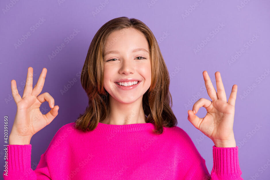 Photo of young beautiful happy cheerful good mood positive girl showing okay sign isolated on violet color background фотография Stock | Adobe Stock