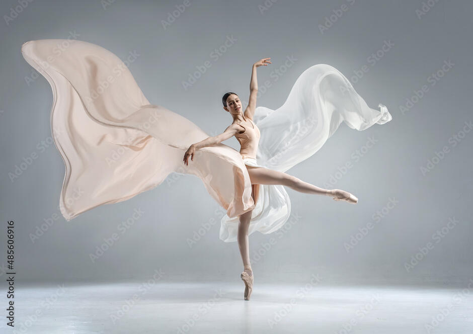 Beautiful ballerina dancing in the body color ballet leotard with body color cloth. She danced on ballet pointe shoes. фотография Stock | Adobe Stock